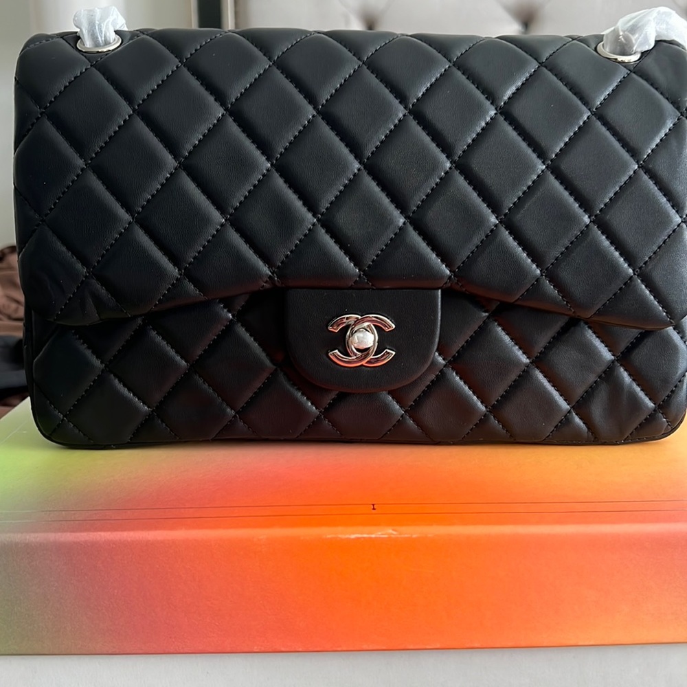 This is Chanel bag. It has never been worn. Comes with original dust bag.